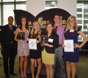 Students pose with awards.