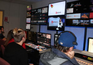 Students work in the control room during a live show.